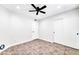 Spacious bedroom with tile flooring and double closets at 6427 W Turquoise Ave, Glendale, AZ 85302