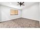 Spacious bedroom with tile flooring and a large window at 6427 W Turquoise Ave, Glendale, AZ 85302