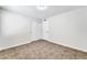 Bright bedroom with tile flooring and double closets at 6427 W Turquoise Ave, Glendale, AZ 85302