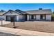 House exterior with a two-car garage and landscaping at 6427 W Turquoise Ave, Glendale, AZ 85302