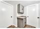 Convenient laundry area with gray cabinets and countertop at 6427 W Turquoise Ave, Glendale, AZ 85302