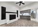 Open concept living room with kitchen views and tile floors at 6427 W Turquoise Ave, Glendale, AZ 85302