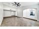 Open living room with views of kitchen and entryway at 6427 W Turquoise Ave, Glendale, AZ 85302