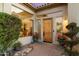 Elegant entryway with wood door and large windows at 7521 E Camino Salida Del Sol --, Scottsdale, AZ 85266