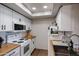 White kitchen with butcher block countertops and stainless steel appliances at 10410 N Cave Creek Rd # 2232, Phoenix, AZ 85020