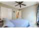 Bedroom with full-size bed and access to bathroom at 10778 W Cambridge Ave, Avondale, AZ 85392