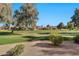 Landscaped backyard with golf course view at 11000 N 77Th Pl # 1004, Scottsdale, AZ 85260