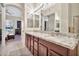 Double vanity bathroom with granite countertops and a view of bedroom at 11000 N 77Th Pl # 1004, Scottsdale, AZ 85260