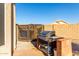 Backyard BBQ area with brick and grill at 11623 W Lemon Ct, Surprise, AZ 85378