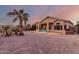 Spacious backyard with gravel landscaping and patio at 11623 W Lemon Ct, Surprise, AZ 85378