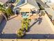 Aerial view of a home with a spacious backyard, featuring desert landscaping and a patio at 11623 W Lemon Ct, Surprise, AZ 85378