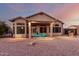 Nice backyard with covered patio and seating area at 11623 W Lemon Ct, Surprise, AZ 85378