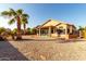 House backyard view with gravel and palm trees at 11623 W Lemon Ct, Surprise, AZ 85378