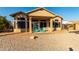 Patio with green chairs and view of house at 11623 W Lemon Ct, Surprise, AZ 85378