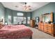 Large bedroom with ceiling fan and plenty of closet space at 11623 W Lemon Ct, Surprise, AZ 85378