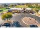 An aerial view of a clubhouse near a golf course at 11623 W Lemon Ct, Surprise, AZ 85378