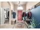 Spacious entryway with decorative accents and view to living room at 11623 W Lemon Ct, Surprise, AZ 85378