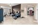 Bright and spacious entryway with tile flooring and access to multiple rooms at 11623 W Lemon Ct, Surprise, AZ 85378