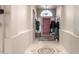 Bright entryway with tiled floors and a red door at 11623 W Lemon Ct, Surprise, AZ 85378