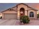 One-story house with a red door and desert landscaping at 11623 W Lemon Ct, Surprise, AZ 85378