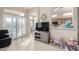Gathering room with view to kitchen and access to backyard at 11623 W Lemon Ct, Surprise, AZ 85378