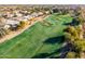 Aerial view of a lush green golf course at 11623 W Lemon Ct, Surprise, AZ 85378