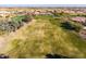 Aerial view of a section of a green golf course at 11623 W Lemon Ct, Surprise, AZ 85378