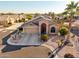 Single-story home with solar panels and desert landscaping at 11623 W Lemon Ct, Surprise, AZ 85378