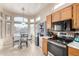Bright kitchen with breakfast nook and modern appliances at 11623 W Lemon Ct, Surprise, AZ 85378