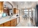 Kitchen boasts ample counter space, wood cabinets, and a breakfast area at 11623 W Lemon Ct, Surprise, AZ 85378
