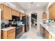 Kitchen with wood cabinets, stainless steel appliances, and breakfast nook at 11623 W Lemon Ct, Surprise, AZ 85378