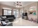 Living room with sectional sofa and access to backyard at 11623 W Lemon Ct, Surprise, AZ 85378