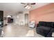 Spacious living area with comfortable seating and tile floors at 11623 W Lemon Ct, Surprise, AZ 85378