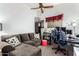 Cozy sitting room featuring a comfortable sectional sofa at 11623 W Lemon Ct, Surprise, AZ 85378