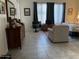 Bedroom with tiled floors, dresser, chair, and TV at 1210 E Westchester Dr, Chandler, AZ 85249