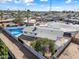 Aerial view of single story home with pool at dusk at 1344 E Ellis Cir, Mesa, AZ 85203