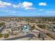 Aerial view of single-story home with pool, showcasing desirable location and neighborhood at 1344 E Ellis Cir, Mesa, AZ 85203