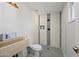 Updated bathroom with a walk-in shower and modern tile at 1344 E Ellis Cir, Mesa, AZ 85203