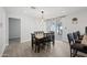 Bright dining room with a table for six and access to the backyard at 1344 E Ellis Cir, Mesa, AZ 85203