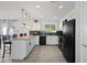 Updated kitchen with granite countertops and stainless steel appliances at 1344 E Ellis Cir, Mesa, AZ 85203