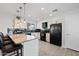 Modern kitchen featuring granite countertops and stylish pendant lights at 1344 E Ellis Cir, Mesa, AZ 85203