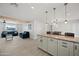 Open concept kitchen with granite island and breakfast bar at 1344 E Ellis Cir, Mesa, AZ 85203