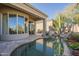 Desert home featuring a private pool with rock waterfall, surrounded by native cacti and plants at 15836 E Brittlebush Ln, Fountain Hills, AZ 85268