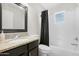 Bathroom with granite vanity and shower/tub combo at 1710 E 1St St, Mesa, AZ 85203