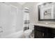 Clean bathroom with granite vanity and shower/tub combo at 1710 E 1St St, Mesa, AZ 85203