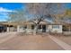 Single story home with mature tree and brick driveway at 1710 E 1St St, Mesa, AZ 85203