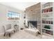 Stone fireplace with built-in shelving on either side at 1710 E 1St St, Mesa, AZ 85203