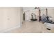 Home gym includes a treadmill and weightlifting equipment at 1710 E 1St St, Mesa, AZ 85203