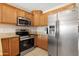Stainless steel appliances and granite countertops in kitchen at 1710 E 1St St, Mesa, AZ 85203