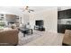 Living room with stone fireplace and built-in shelving at 1710 E 1St St, Mesa, AZ 85203